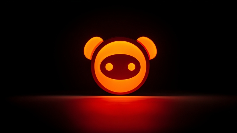Glowing Reddit logo icon on a dark background representing community identity